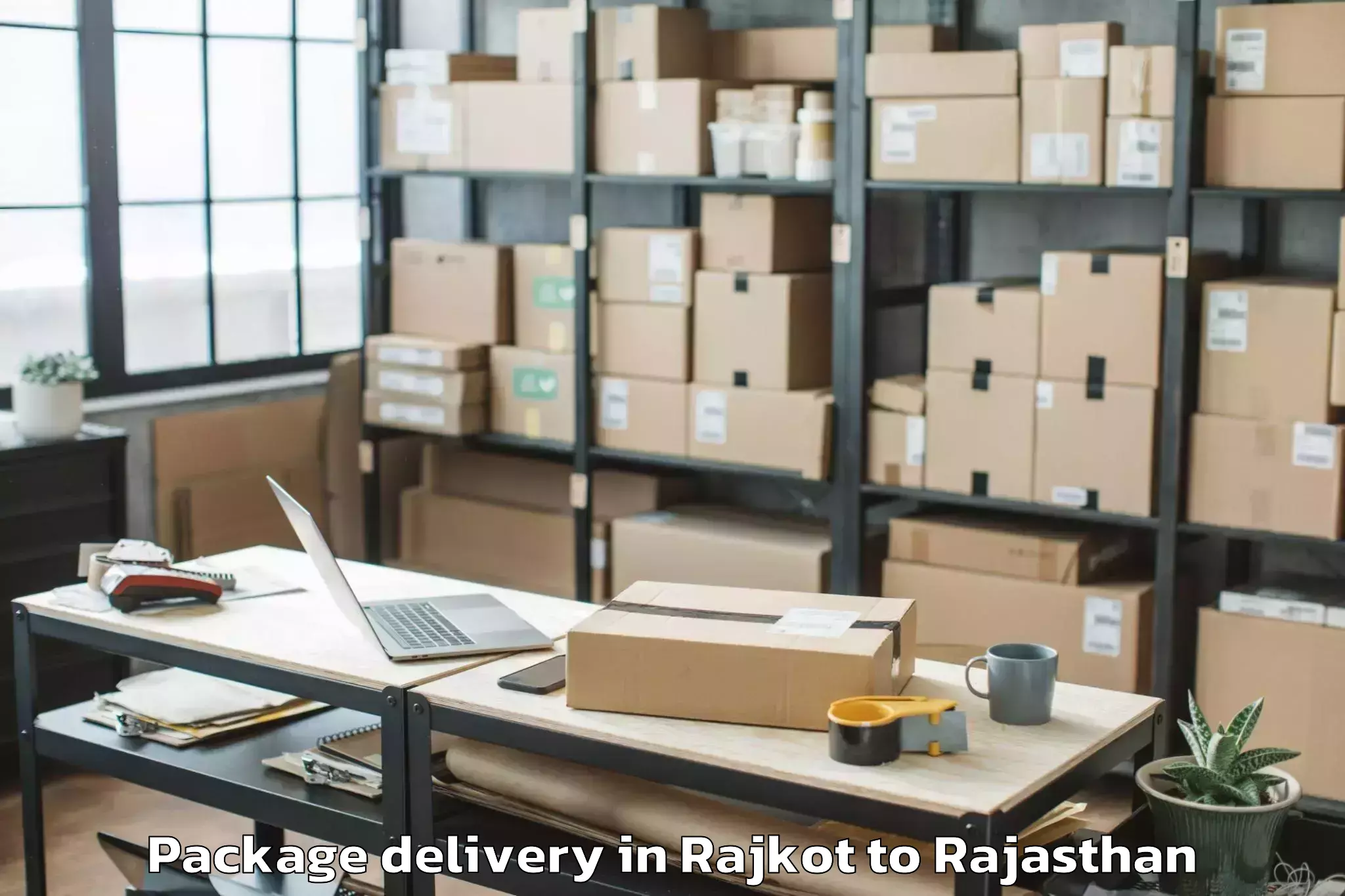 Professional Rajkot to Jodhpur National University Jo Package Delivery